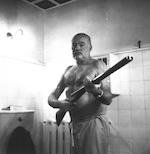 Hemingway bare chested w gun